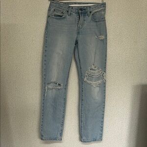Woman Distressed Blue Jeans